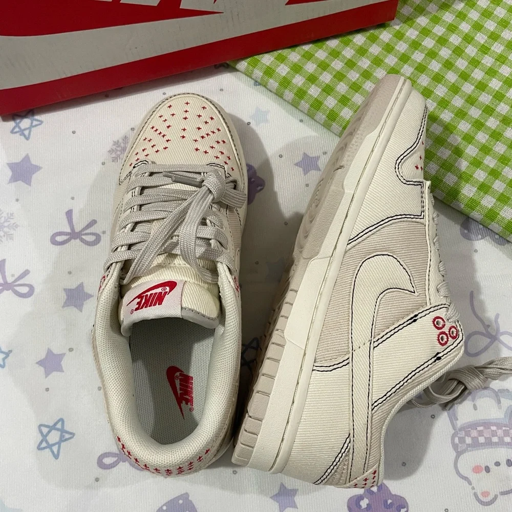 Nike Low-Top Sneakers in Cream with Red Details